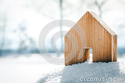 Small wooden House standing in the snow, planning Housebuilding on the building area Stock Photo