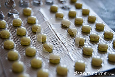 Yellow pills tablets blaster Stock Photo
