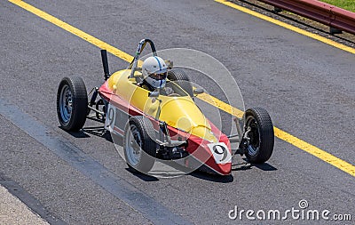 Small yellow and red vintage racing car Editorial Stock Photo