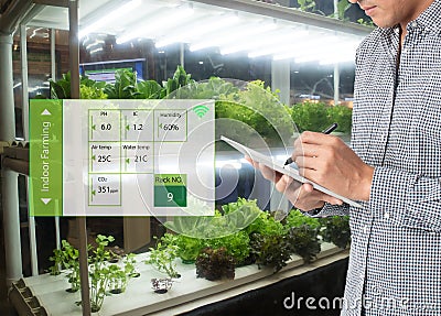 Smart agriculture in futuristic concept, farmer use technology t Stock Photo