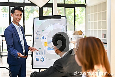 Smart Asian businessman lead the meeting, sharing his ideas in the meeting to his team Stock Photo