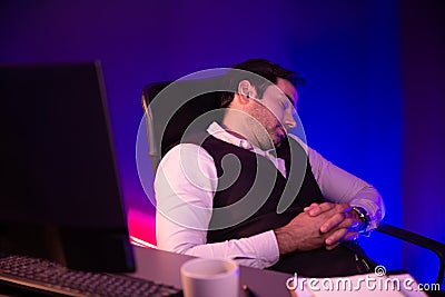Smart businessman leaning on chair with working desk. Surmise. Stock Photo
