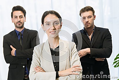 Smart businesswomen manager standing confident team group arm crossed with male teamwork in modern office happy smiling Stock Photo