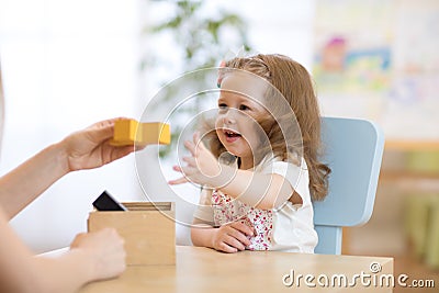 Smart child with didactic toys in preschool Stock Photo