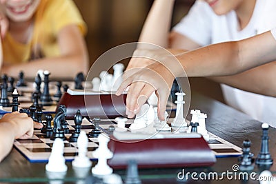 Smart, cute, young boy is making a move on the chessboard. Education concept, intellectual game, training Stock Photo