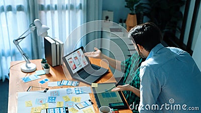Smart developer compare Ux Ui design and planning for development. Convocation. Stock Photo