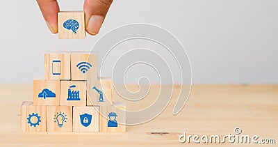 Smart factory, industry 4.0 futuristic technology trend concept, Hand man put the icon to connect, icons including wifi, ai ,artif Stock Photo