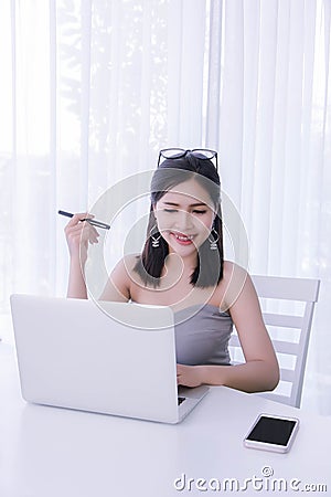 Smart girl`s working on notebook , Workingwoman using laptop in Stock Photo