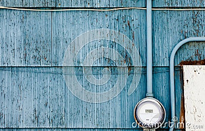 Smart grid power supply meter on grungy blue wall Stock Photo