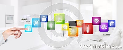 Smart home automation hand touch screen with colored symbols on interior rooms blurred background web banner and copy space Stock Photo