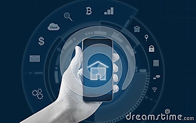 Smart home and buildings mobile application. Hand holding mobile smart phone Stock Photo