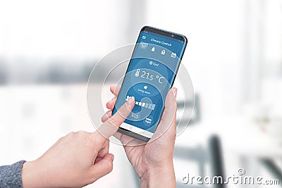 Smart home climate control app on phone display concept Stock Photo