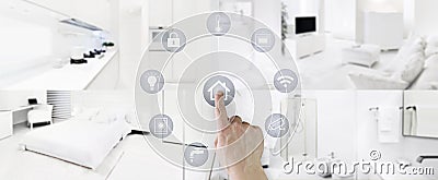 Smart home control concept hand touch icons screen with interiors, living room, kitchen, bedroom and bathroom on blurred Stock Photo