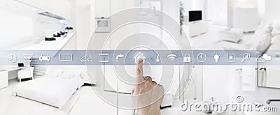 Smart home control concept hand touch icons screen with interiors, living room, kitchen, bedroom and bathroom on blurred Stock Photo