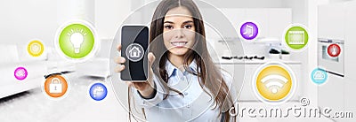 Smart home smiling woman showing cell phone screen with colored Stock Photo