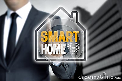 Smart Home touchscreen is operated by a businessman Stock Photo