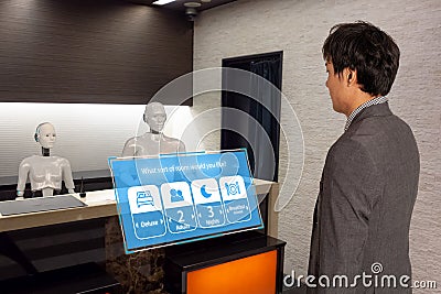 Smart hotel in hospitality industry 4.0 concept, the receptionist robot robot assistant in lobby of hotel or airports always w Stock Photo