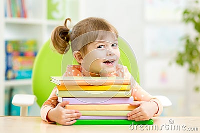 Smart kid girl preschooler with books Stock Photo
