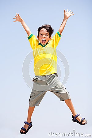 Smart kid jumping high in air Stock Photo
