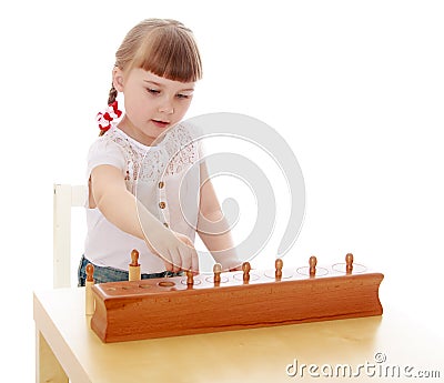 Smart little girl in a Montessori kindergarten Stock Photo
