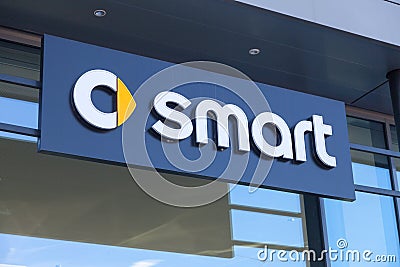 Smart logo on a car dealer building Editorial Stock Photo