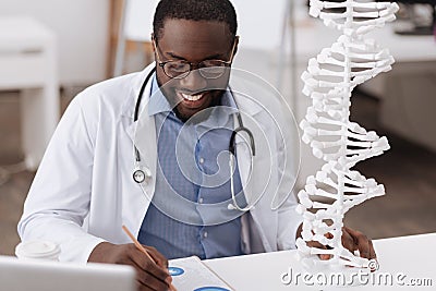 Smart male scientist studying genetics Stock Photo
