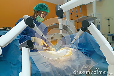 Smart medical health care concept, surgery robotic machine use allows doctors to perform many types of complex procedures with mor Stock Photo