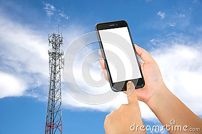 Smart phone in hand with mobile towers background. Stock Photo