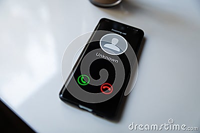 phone with incoming call from unknown caller. concept of scam spam and shadow calls Stock Photo