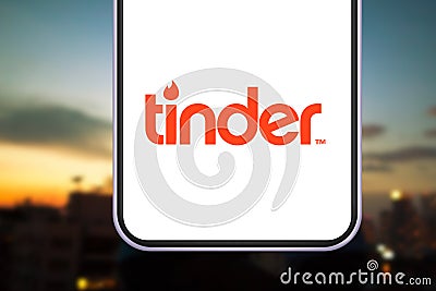 Smart Phone with the TINDER logo Editorial Stock Photo