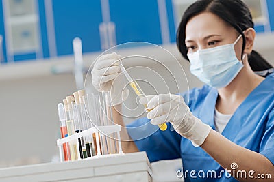 Smart professional chemist taking test samples Stock Photo