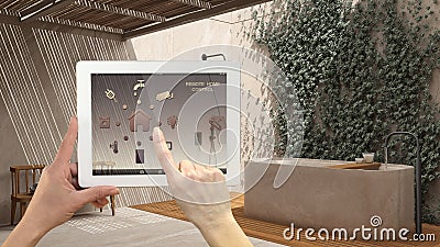 Smart remote home control system on a digital tablet. Device with app icons. Japanese zen bathroom with bathtub and garden with Stock Photo