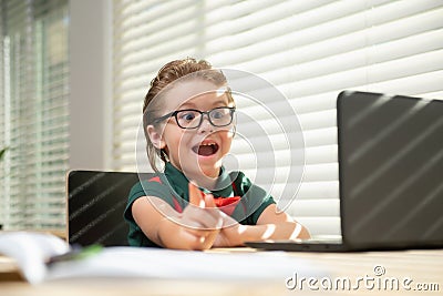 Smart school pupil kid virtual distance learning online, watching remote digital class lesson, looking at laptop Stock Photo