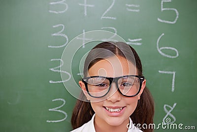 Smart schoolgirl posing Stock Photo