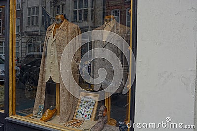 Smart Suits in fashion clothing boutique window Editorial Stock Photo