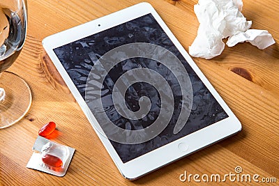 Smart tablet cell phone spreads common cold flu from not clean dirty hands spreading germs and bacteria Stock Photo