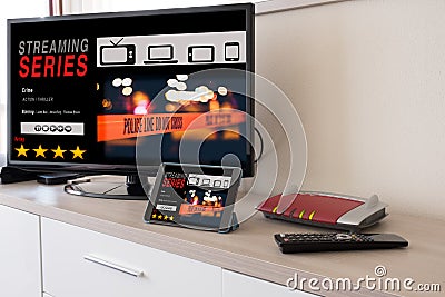 Smart tv and digital tablet connected to internet modem Stock Photo