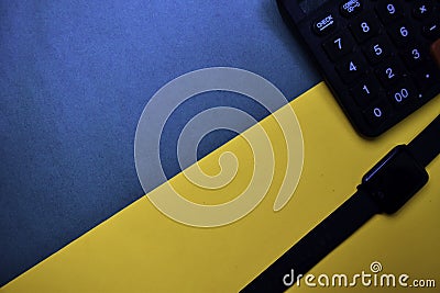 Smart Watch and Calculator text on top view color table background Stock Photo
