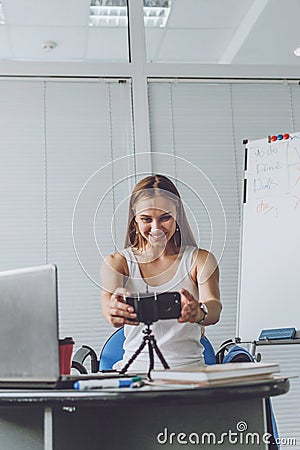 Smart working, agile, remotely working, Flexible hours, rearranged offices, new way of organising work. Young woman, company Stock Photo