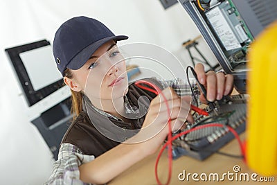 Smart young woman testing 3d printing components Stock Photo