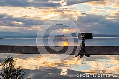 Smartphone attached on flexible tripod Stock Photo