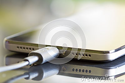 Smartphone battery charging technology background Stock Photo