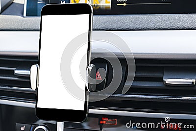 Smartphone in a car use for Navigate or GPS. Driving a car with Smartphone in holder. Mobile phone with white screen. Stock Photo