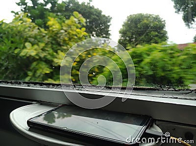 Smartphone charging time sidebar windows on the train Stock Photo