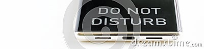 Smartphone with do not disturb message on light background. Concept of interruption in work Stock Photo