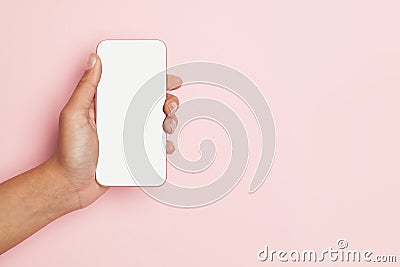 Smartphone in female hand on pink banner background Stock Photo