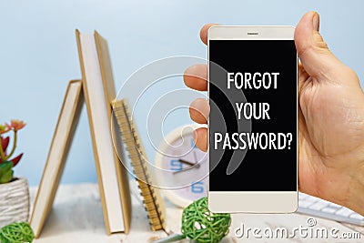 Smartphone in hand with the inscription Forgot your password Stock Photo