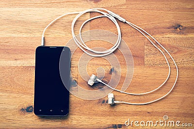 Smartphone with headphones Stock Photo