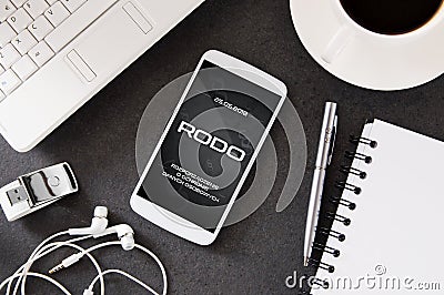 Smartphone lies on desk with RODO sign on display Stock Photo