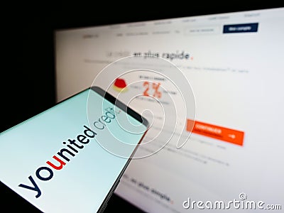 Smartphone with logo of French financial platform company Younited Credit on screen in front of website. Editorial Stock Photo